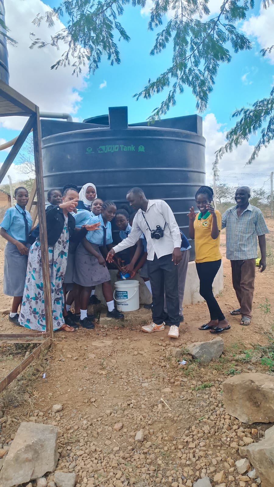Water delivery truck arriving at school