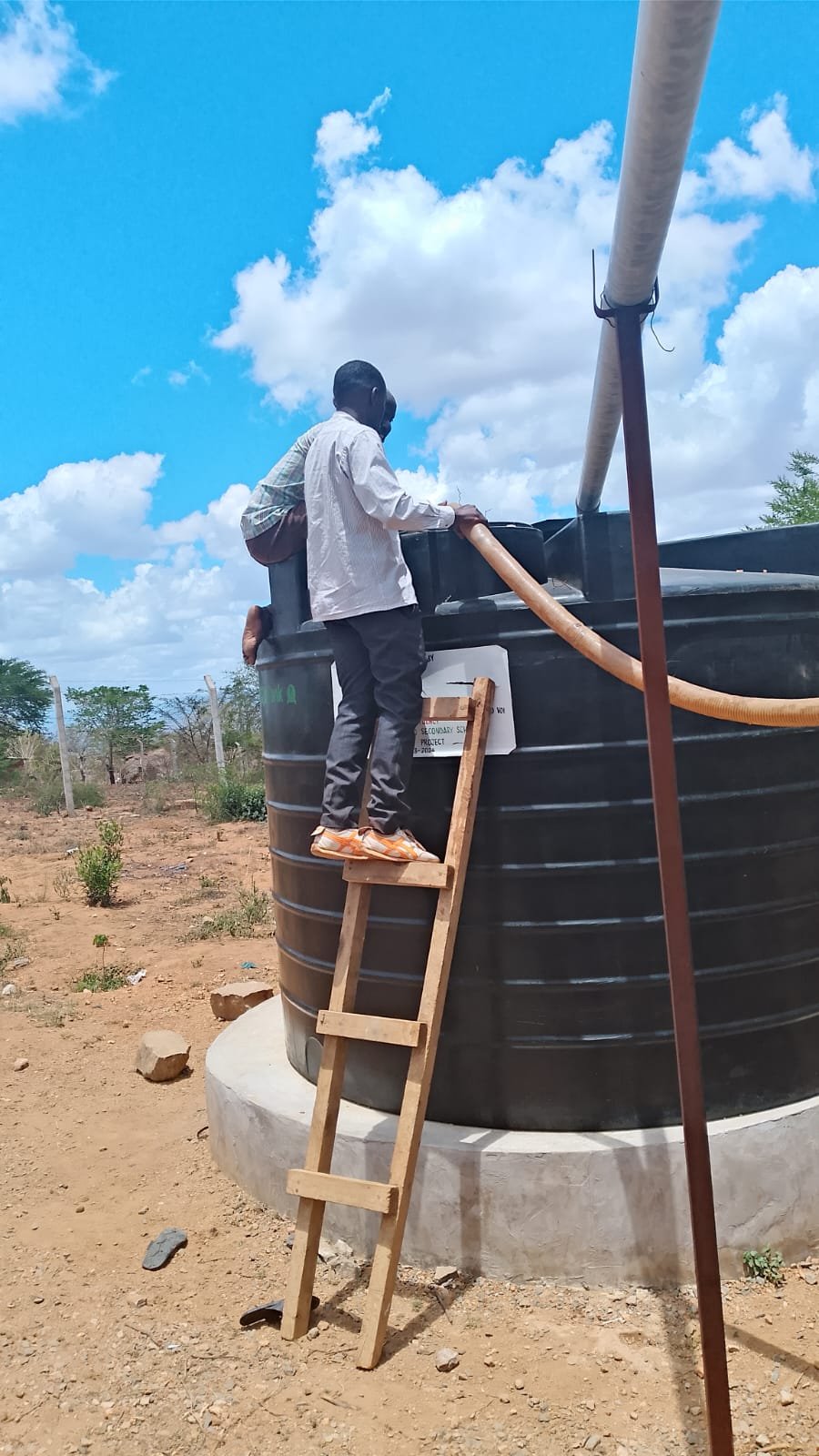 Students receiving water relief support